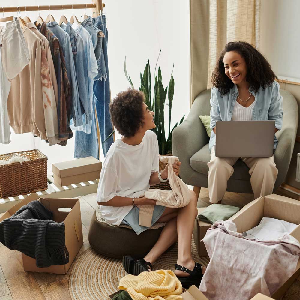 two women sort through items