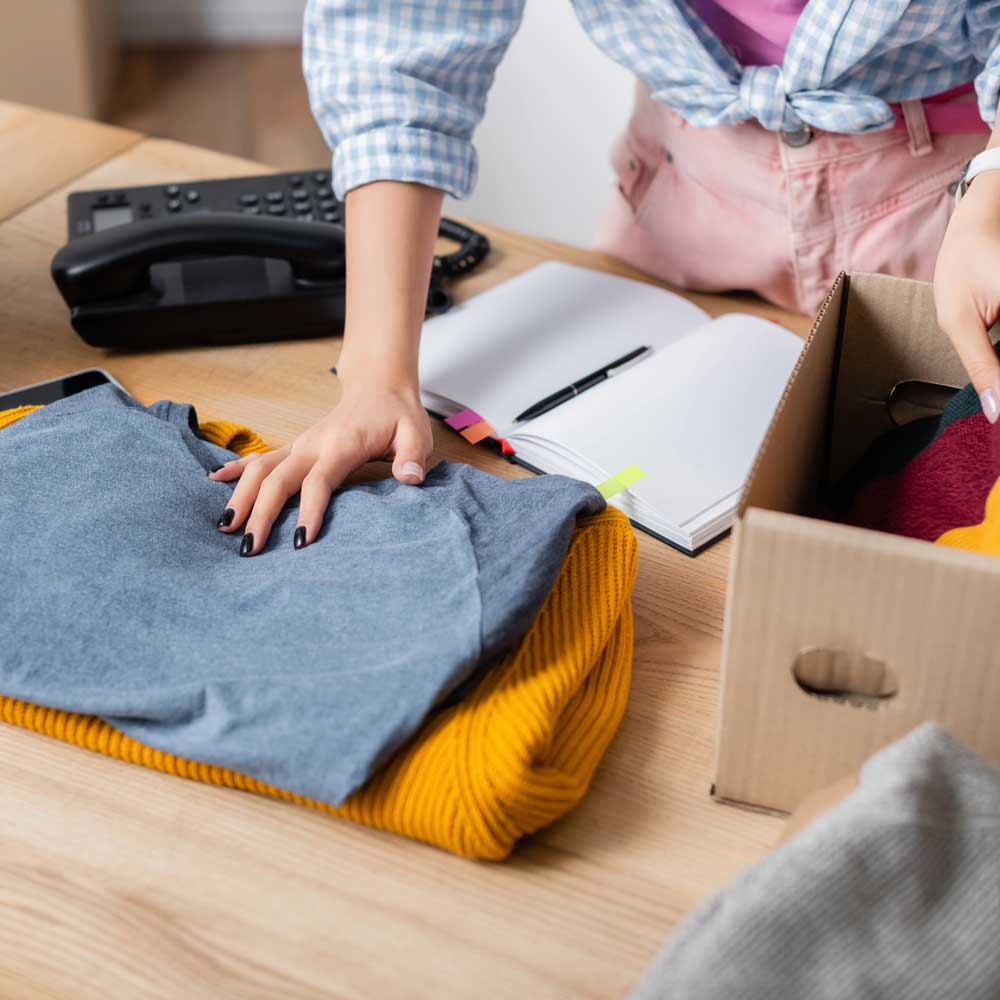 a woman unpacks a box