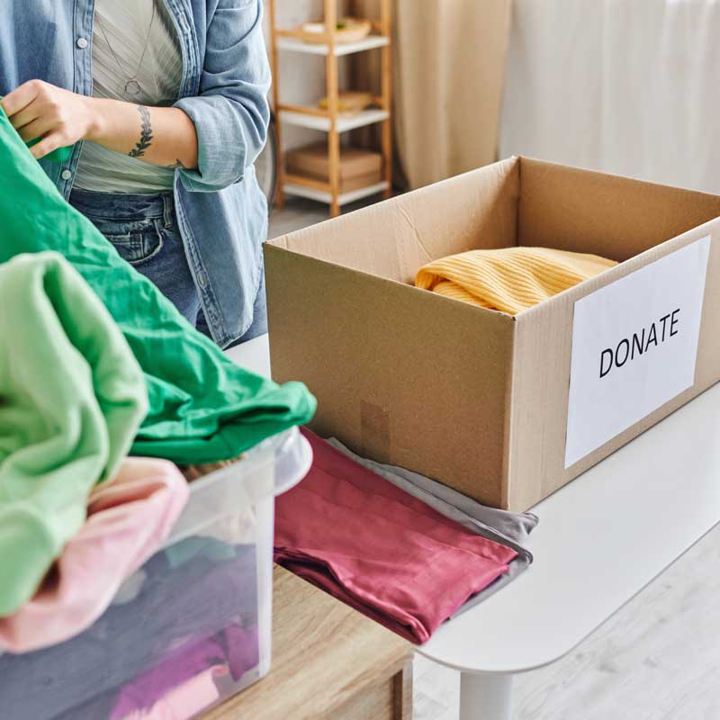 a woman donating clothes